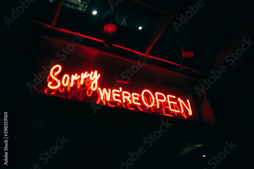 sorry we're open signage photo