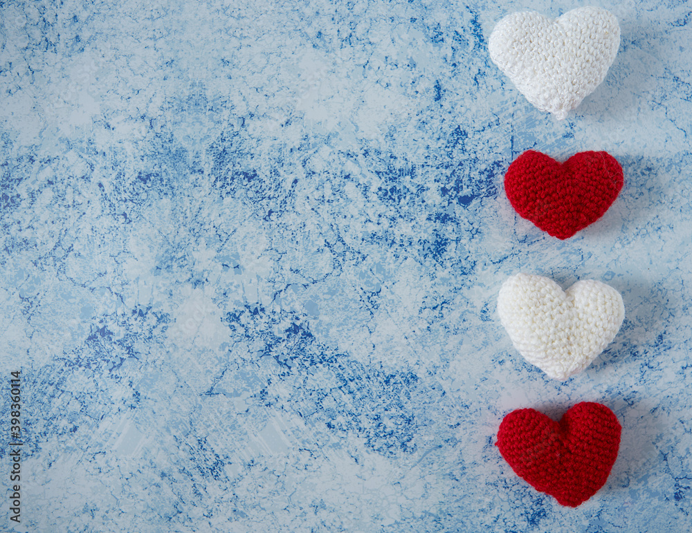 Obraz premium knitted hearts and empty space for your text