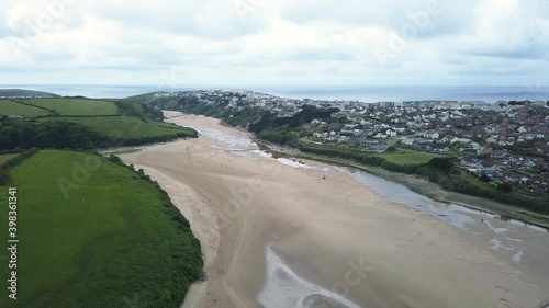 River Gannel During Low Tide Between Newquay Town And Crantock Green Hills In England, United Kingdom. - aerial ascend photo