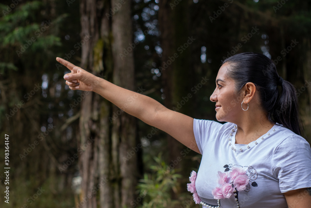 Beautiful woman smiling in the forest Beautiful woman smiling in the forest