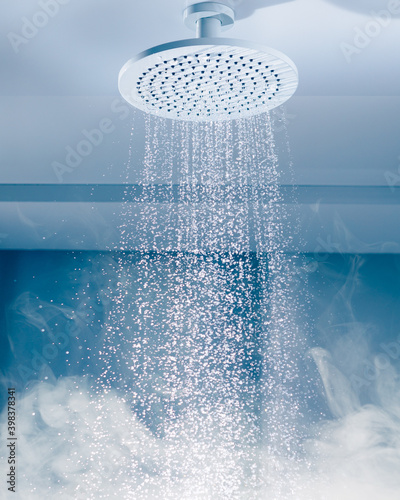 contrast shower with flowing water stream and steam photo