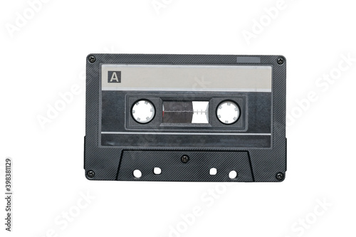 Black cassette with magnetic tape isolated on a white background.