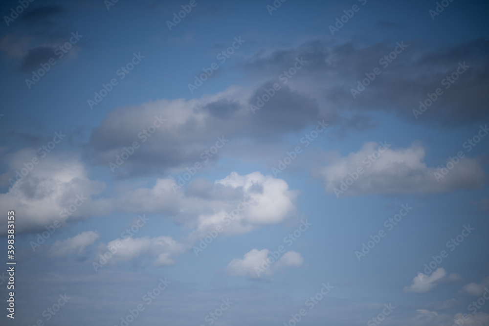 Beautiful sky background. Light blue and gray sky with a dramatic view of clouds. High quality photo