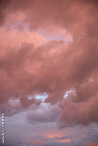 Beautiful sky background. Light blue sky with dramatic orange, pink and gray clouds. Perfect for sky replacement. High quality photo © Avi