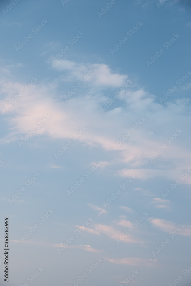 Beautiful sky background. Light blue sky with soft white clouds. Perfect for sky replacement. High quality photo