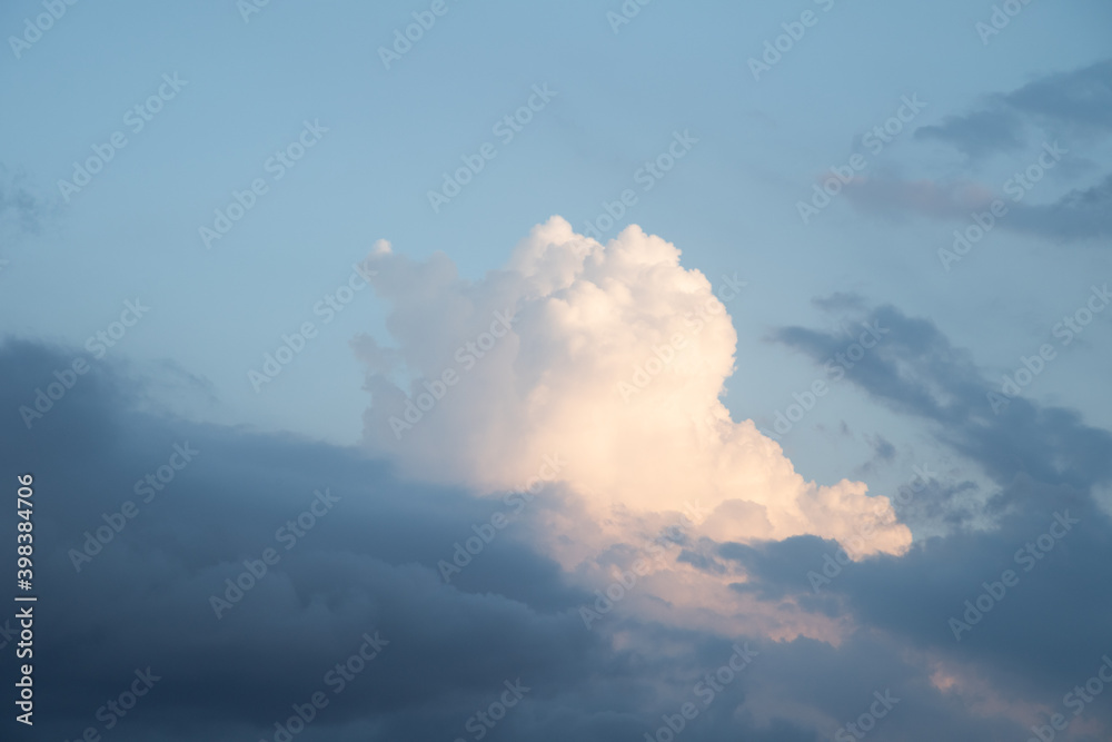 Beautiful sky background. Light blue sky with dramatic orang, pink, and gray clouds. Perfect for sky replacement. High quality photo