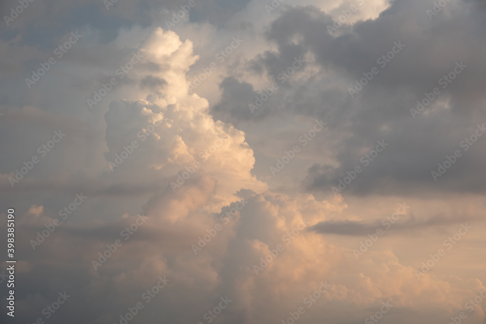 Beautiful sky background. Dramatic orange, white, and gray clouds. Perfect for sky replacement. High quality photo