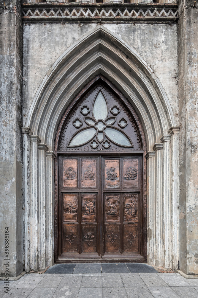 Brass door with bas reliefs captured at St Joseph's cathedral in the old quarter of Hanoi, Vietnam Brass door with bas reliefs captured at St Joseph's cathedral in the old quarter of Hanoi, Vietnam