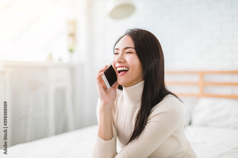 young woman talking with friend on mobile phone and smiling young woman talking with friend on mobile phone and smiling