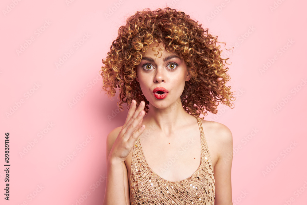 Fototapeta premium Woman portrait Surprised look of gesticulating with hands curls fashion clothes Copy space