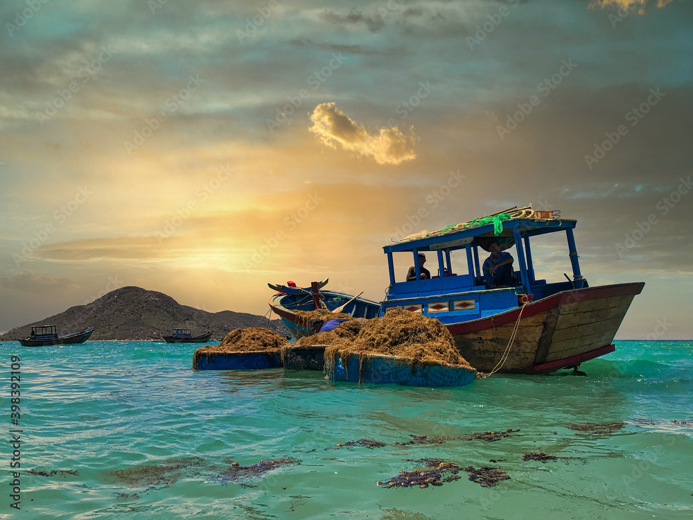 Fototapeta premium wooden fishing boat in the open ocean