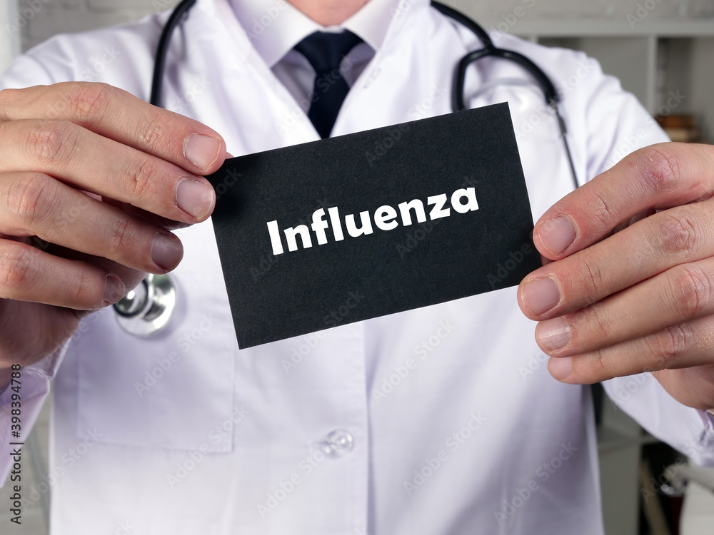 Medical concept meaning Influenza with phrase on the piece of paper. Medical concept meaning Influenza with phrase on the piece of paper.