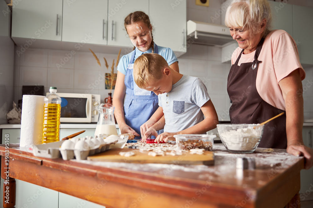 Happy family learning how to cook at home Happy family learning how to cook at home