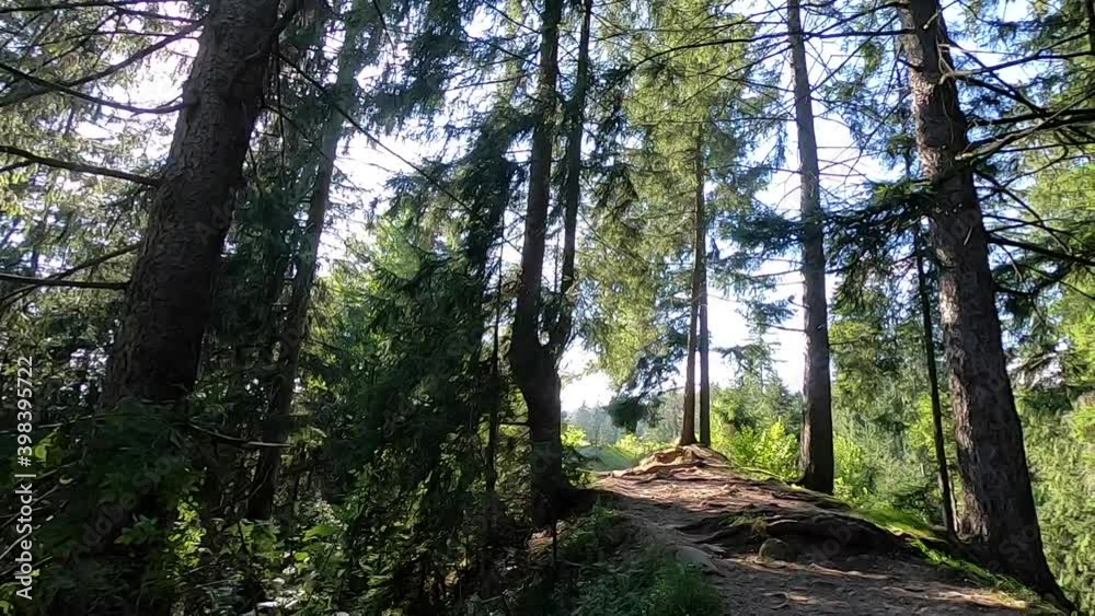 Man climbs along a slope on a mountain Man climbs along a slope on a mountain