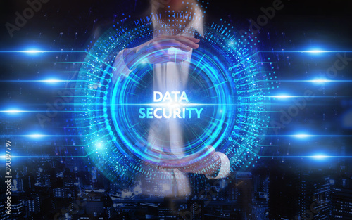 Business  Technology  Internet and network concept. Young businessman working on a virtual screen of the future and sees the inscription  Data security