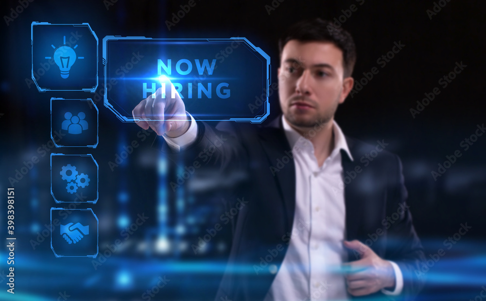 Business, Technology, Internet and network concept. Young businessman working on a virtual screen of the future and sees the inscription: Now hiring Business, Technology, Internet and network concept. Young businessman working on a virtual screen of the future and sees the inscription: Now hiring
