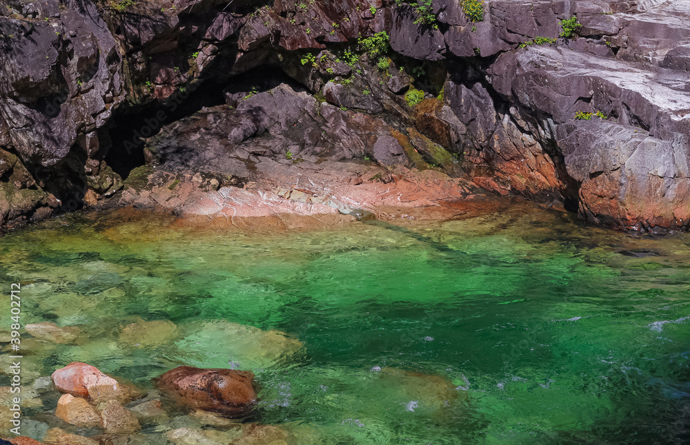 Beautiful landscape of the forest river with greenish water flowing and rocky stones. Beautiful landscape of the forest river with greenish water flowing and rocky stones.