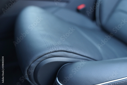Car interior. The seat is made of genuine leather from a close distance.