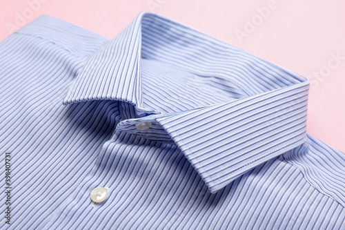 New male shirt on color background