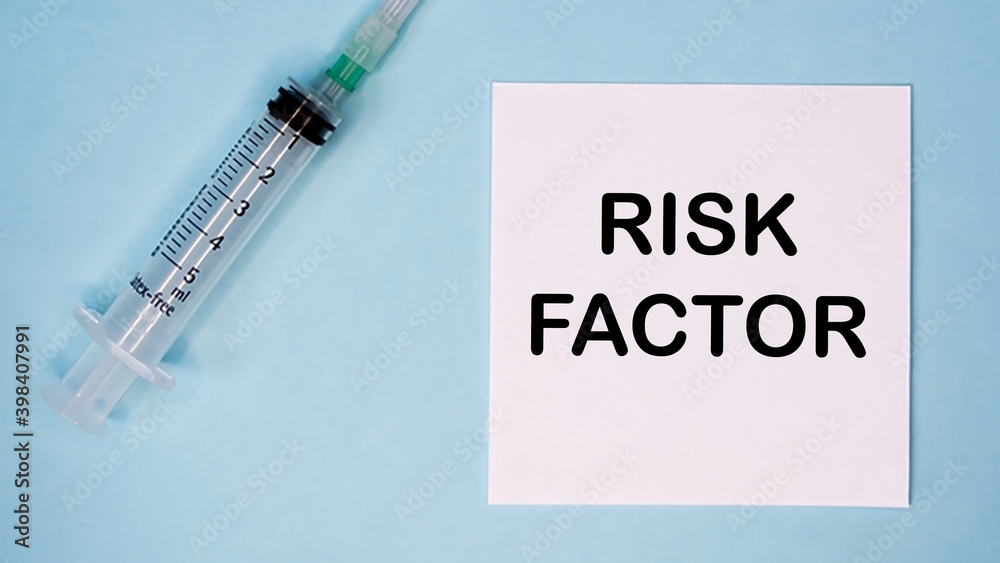 'Risk factor' message on sticker with syringe near. Medical concept.