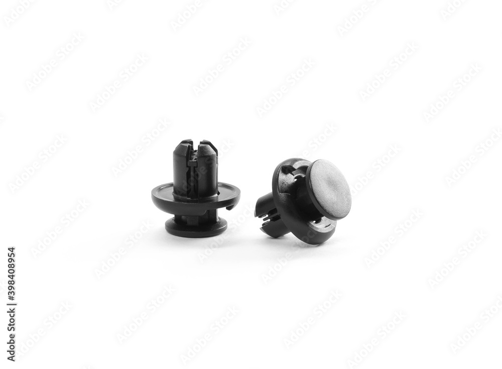 Plastic black clips for the car. Close up. Isolated on a white background Plastic black clips for the car. Close up. Isolated on a white background