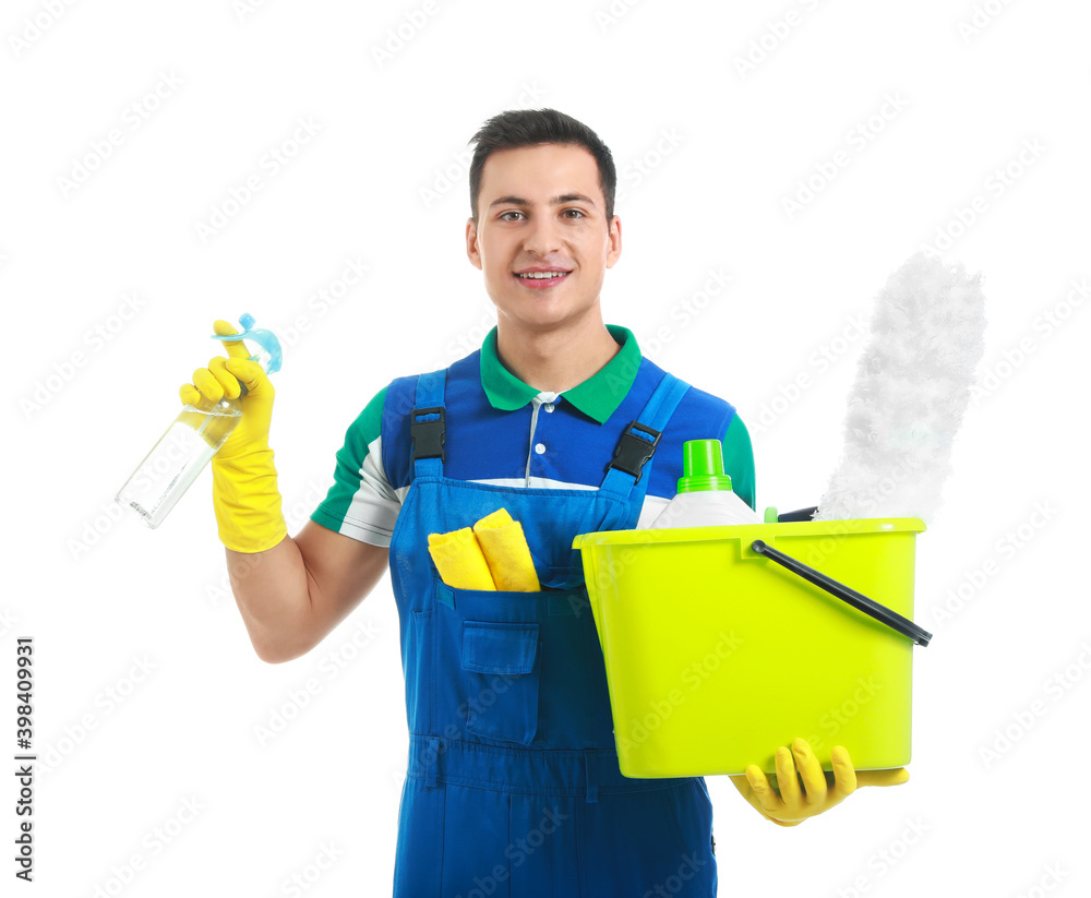 Young male janitor with cleaning supplies on white background Young male janitor with cleaning supplies on white background