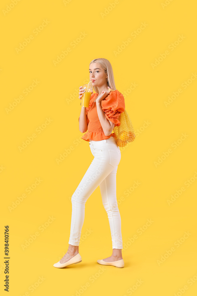 Beautiful young woman with oranges and juice on color background Beautiful young woman with oranges and juice on color background