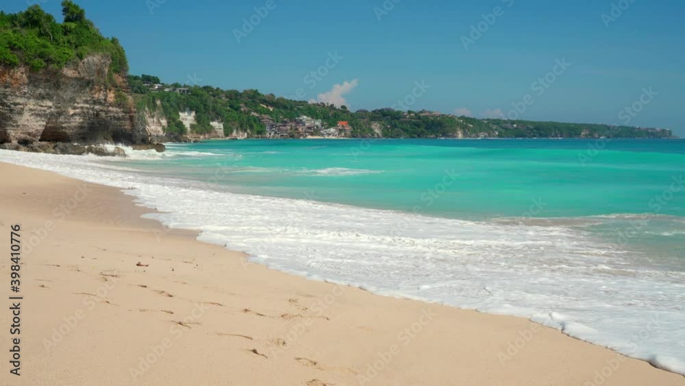 Beautiful sand beach with crystal clear ocean on background blue sky. 4K Beautiful sand beach with crystal clear ocean on background blue sky. 4K