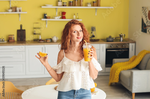 Beautiful young woman drink...
