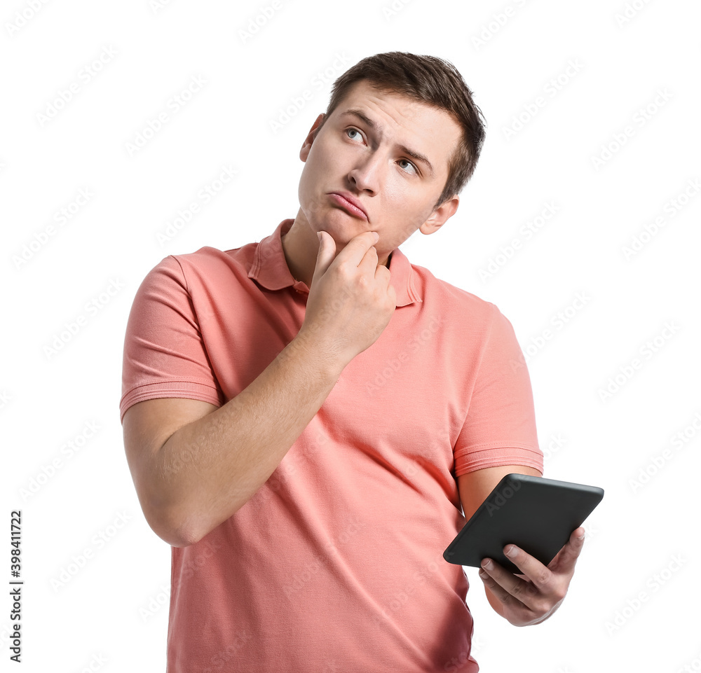 Thoughtful young man with e-reader on white background Thoughtful young man with e-reader on white background