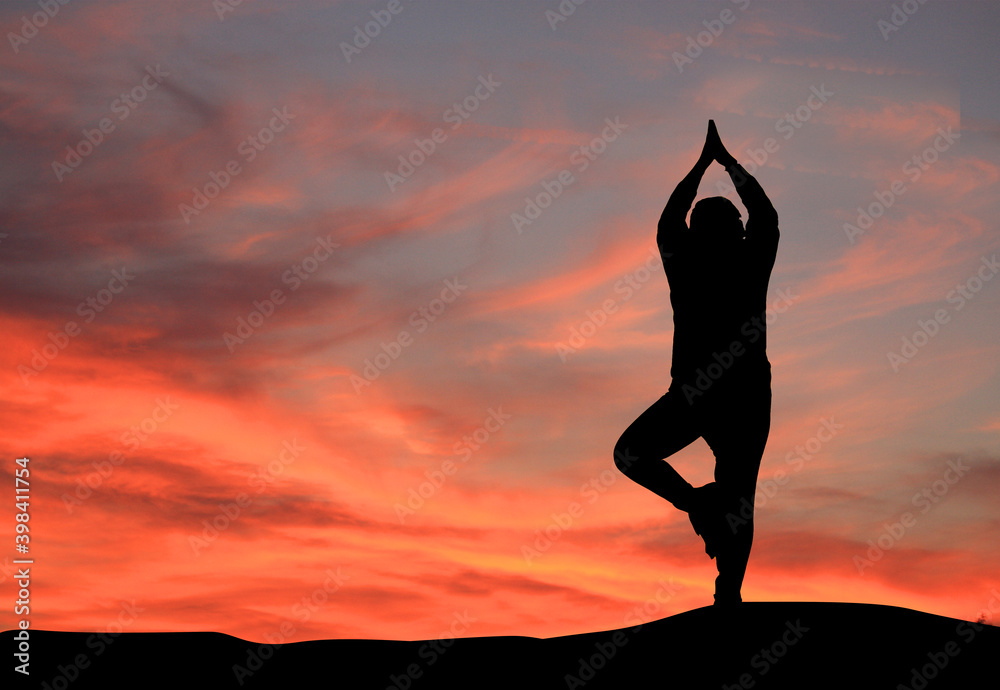 silhouette of a girl practicing yoga, woman doing yoga on the top of the mountain. prayer background. Meditation Background.