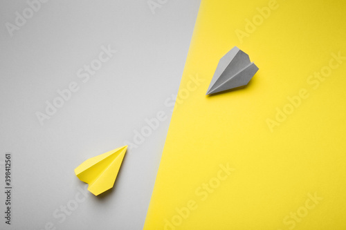 Trend photography on the theme of the new color of the year 2021: Ultimate Gray and Illuminating. yellow and gray planes on the background with copy space