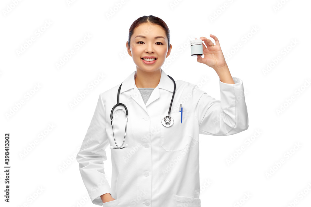 medicine, profession and healthcare concept - happy smiling asian female doctor or nurse with stethoscope holding jar of pills over white background medicine, profession and healthcare concept - happy smiling asian female doctor or nurse with stethoscope holding jar of pills over white background