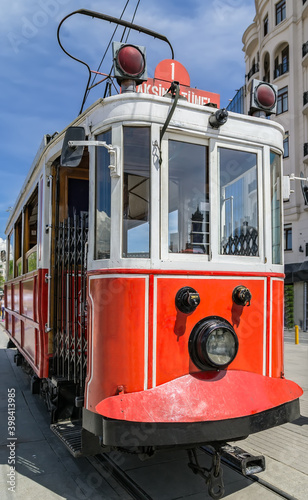 Istanbul nostalgic tramways. Vintage red and white tram on the street. photo