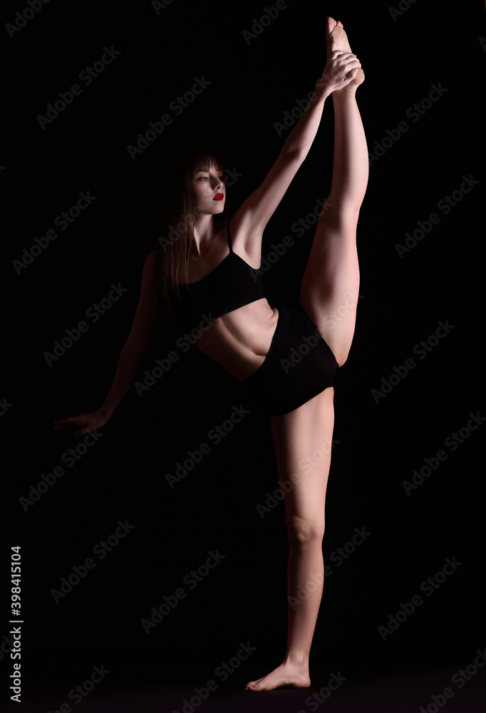 Beautiful young woman in underwear on dark background Beautiful young woman in underwear on dark background