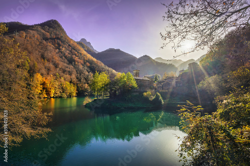 Isola Santa medieval village and lake in autumn foliage. Garfagnana, Tuscany, Italy. photo