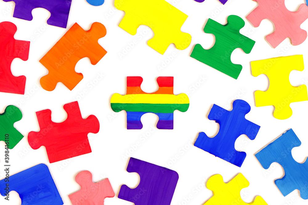 LGBT concept. Rainbow colored puzzle isolated on white background. Gay Pride. Concept of equality, acceptance of sexual minorities lesbian, gay, bisexual, transgender LGBT concept. Rainbow colored puzzle isolated on white background. Gay Pride. Concept of equality, acceptance of sexual minorities lesbian, gay, bisexual, transgender