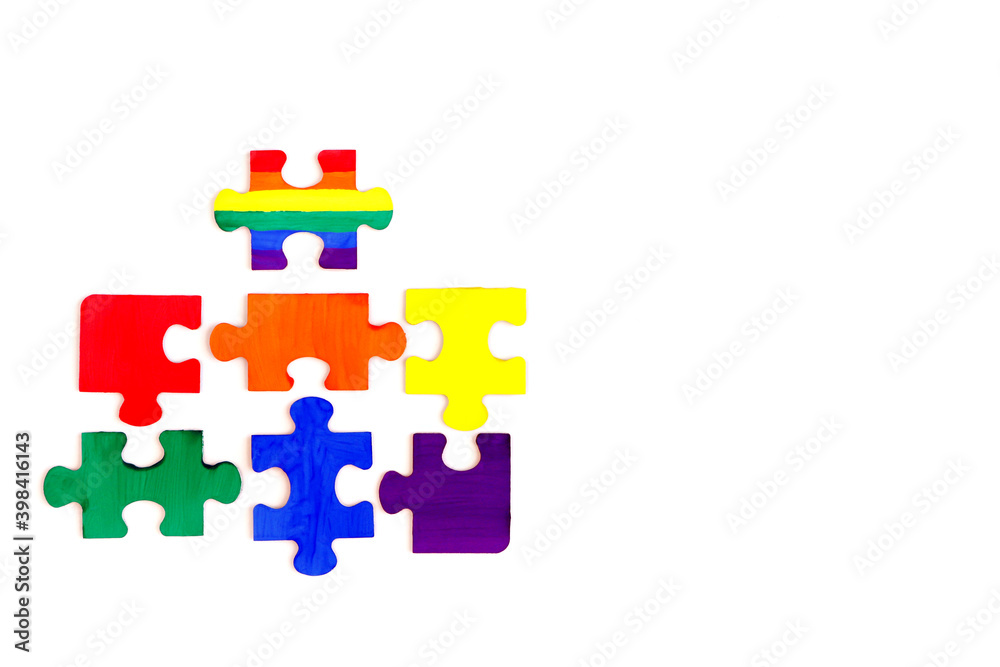 LGBT concept. Rainbow colored puzzle isolated on white background. Gay Pride. Concept of equality, acceptance of sexual minorities lesbian, gay, bisexual, transgender LGBT concept. Rainbow colored puzzle isolated on white background. Gay Pride. Concept of equality, acceptance of sexual minorities lesbian, gay, bisexual, transgender