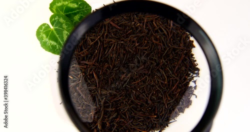 herbal tea in dry leaves close-up on a white background video 4k