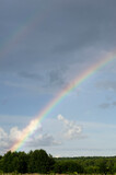 Colorful  rainbow over cloudy sky
