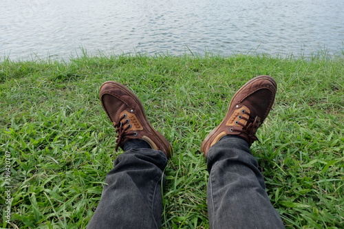 Sit back and relax on the grass in the park. © Weerayuth