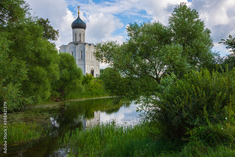 Church of the Intercession on the Nerl - a historical UNESCO monument within the Golden Ring of Russia. Reflection in water, river Nerl