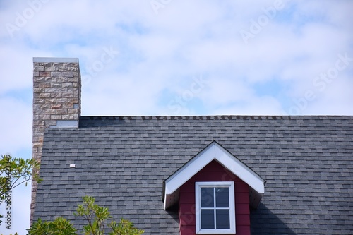 A house roof with a chimney.