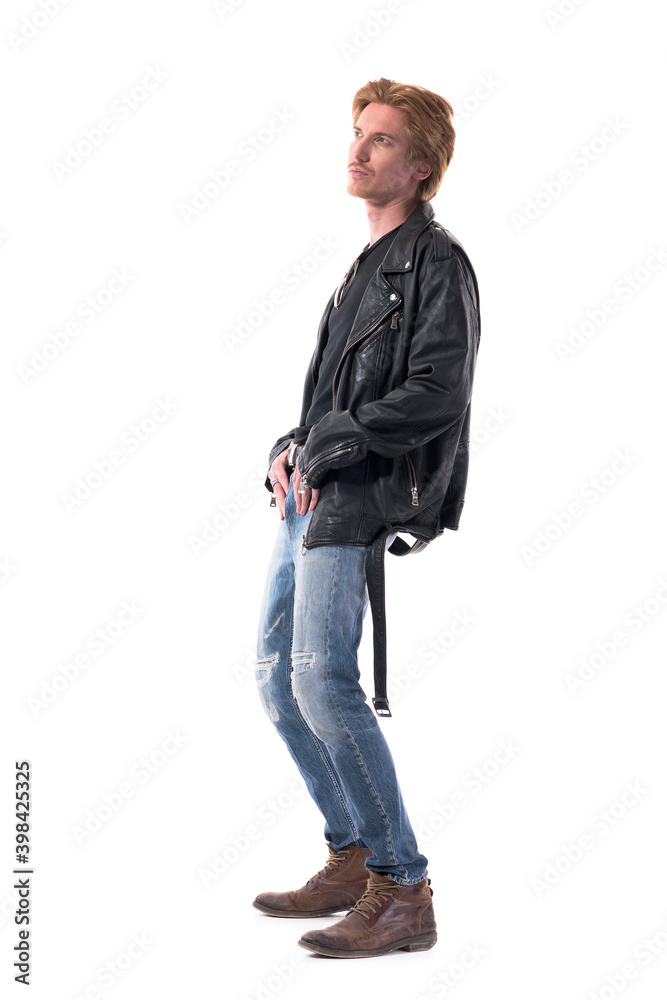 Side view of stylish handsome redhead man in biker leather jacket posing looking up bend backward. Full body length isolated on white background. Side view of stylish handsome redhead man in biker leather jacket posing looking up bend backward. Full body length isolated on white background.