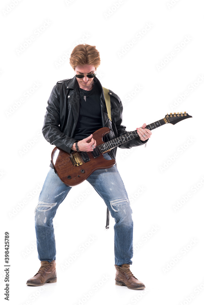 Passionate young talented rock musician guitarist playing electric guitar bending down. Full body length isolated on white background. Passionate young talented rock musician guitarist playing electric guitar bending down. Full body length isolated on white background.