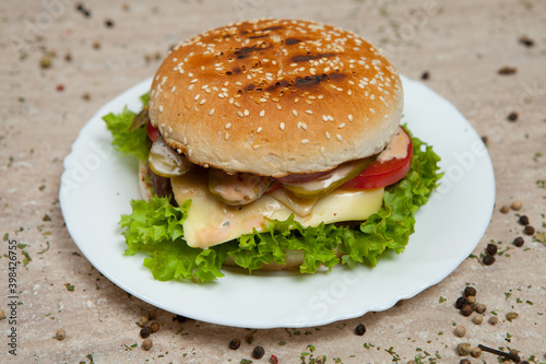 Fresh and juicy hamburger. Delicious cheese burger on a rustic wooden table