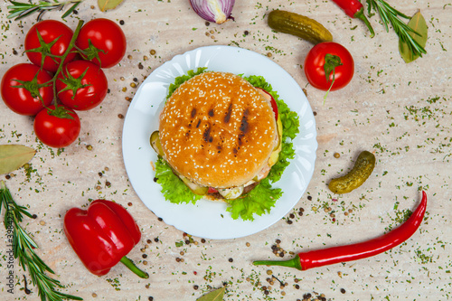 Fresh and juicy hamburger. Delicious cheese burger on a rustic wooden table