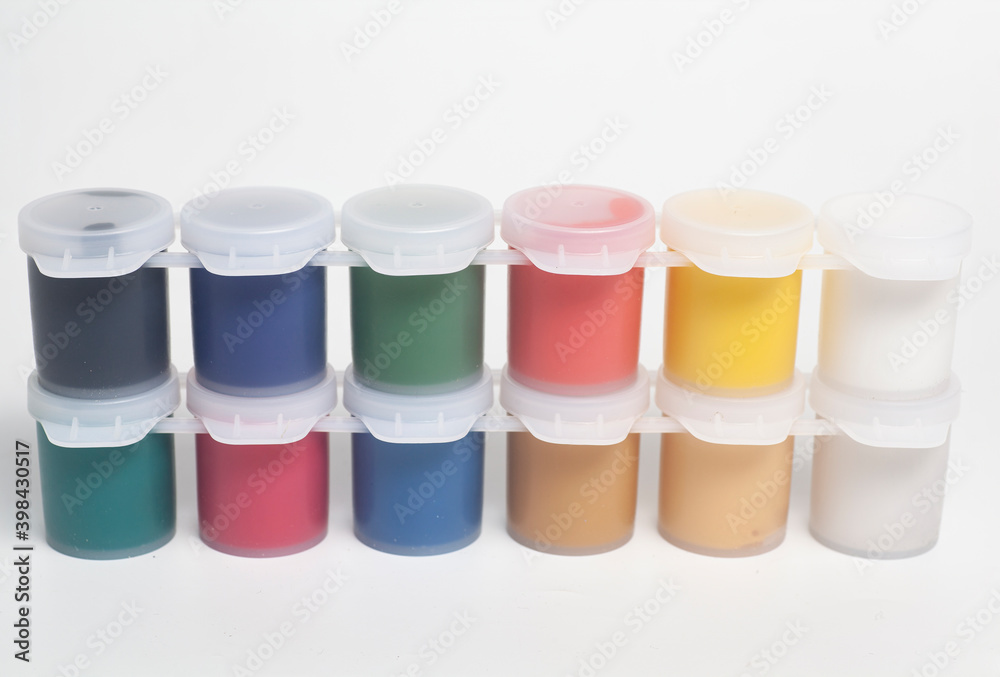 Plastic jars with multicolored gouache paints Plastic jars with multicolored gouache paints