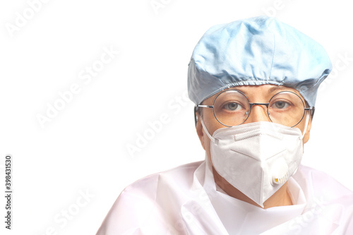 Portrait of female doctor wearing protective mask and sterile clothes