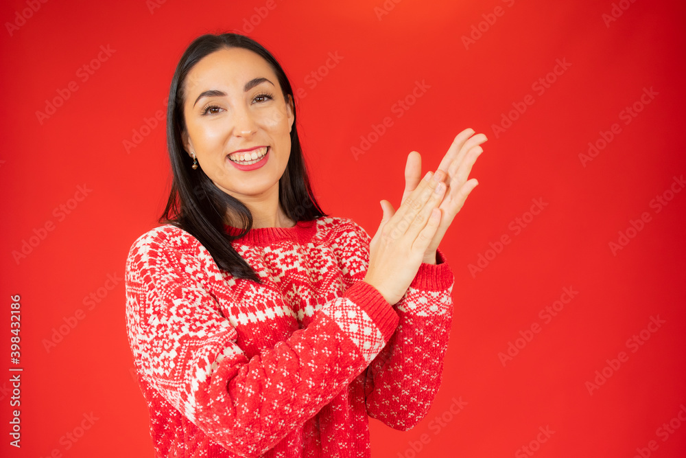 Young brunette woman applauding after presentation in a conference over isolated background Young brunette woman applauding after presentation in a conference over isolated background